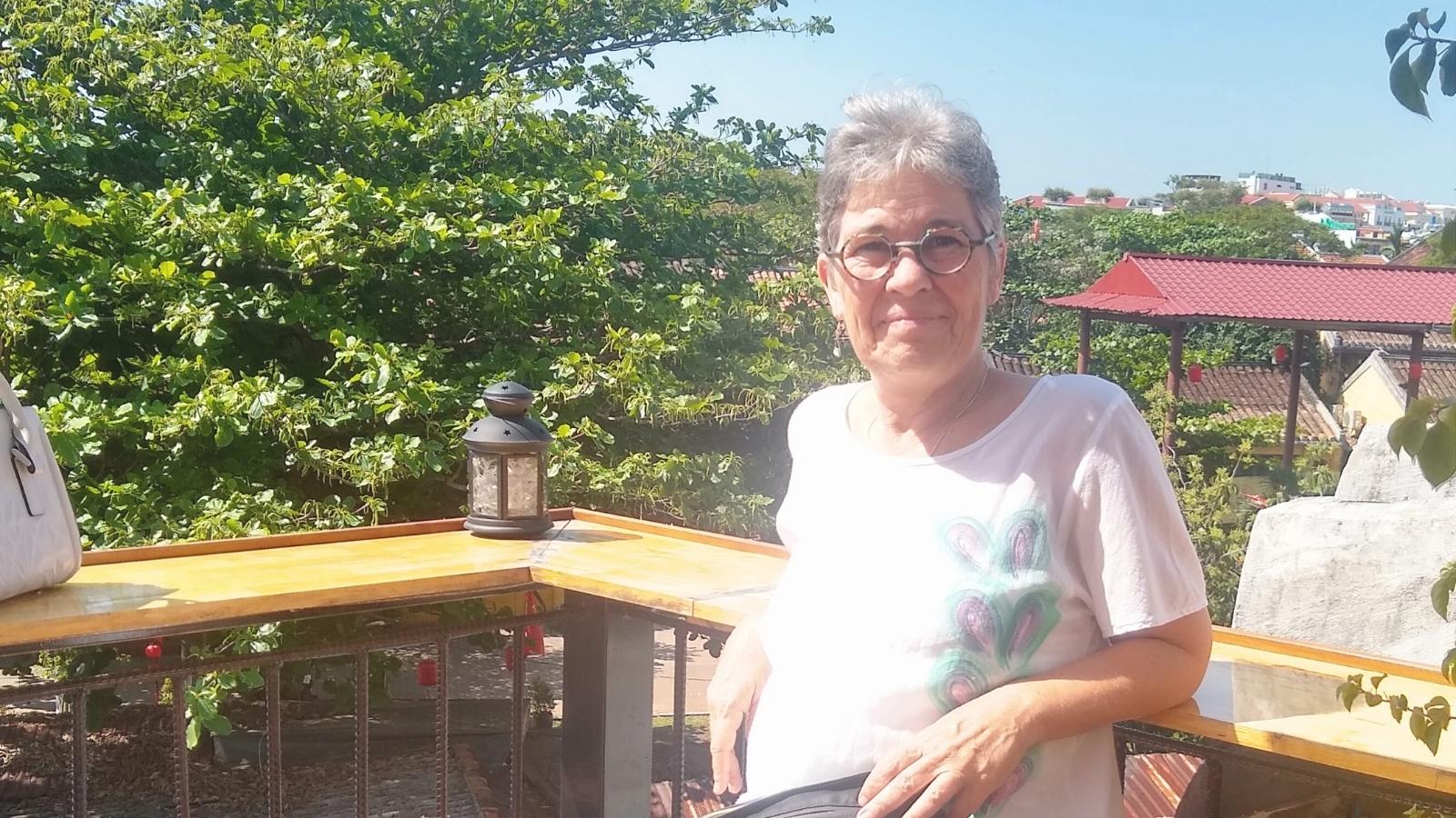 Michelle sitting at a roof top cafe in Hoi An, Vietnam