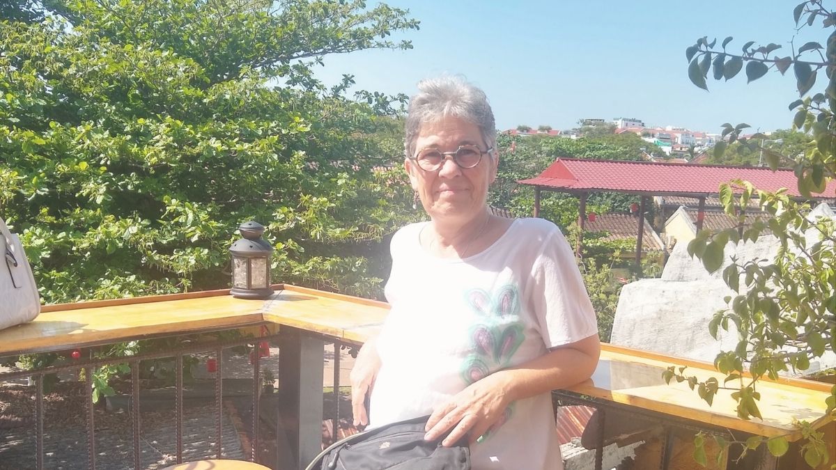 Michelle sitting at a rooftop cafe in Hoi An